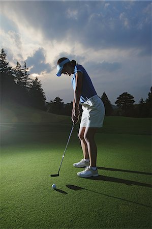 full body shot of woman - Female Golfer Putting Stock Photo - Rights-Managed, Code: 858-06756184