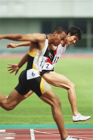 finished - Runners Crossing Finish Line Stock Photo - Rights-Managed, Code: 858-06756349