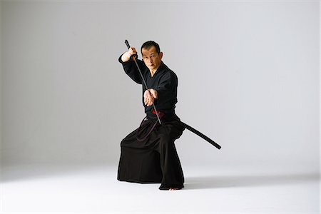 digno - Japanese sword master performing his craft Foto de stock - Con derechos protegidos, Código: 858-08421558