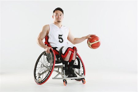 paraolimpionici - Wheelchair basketball player Fotografie stock - Rights-Managed, Codice: 858-08421651