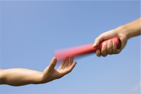 relay in sports - Relaying a Baton Stock Photo - Rights-Managed, Code: 858-03044320