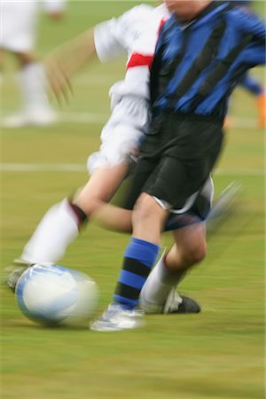 Soccer players competing for the soccer ball Stock Photo - Rights-Managed, Code: 858-03046572