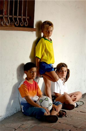 soccer boys sit on the ball - Portrait of Young Soccer Players Stock Photo - Rights-Managed, Code: 858-03046591