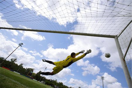 soccer goalie saves - Soccer Goalie Diving For Ball Stock Photo - Rights-Managed, Code: 858-03046682