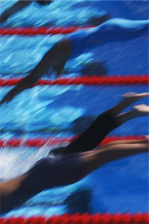 profile of person diving into pool - Swimmers diving into water Stock Photo - Rights-Managed, Code: 858-03046802