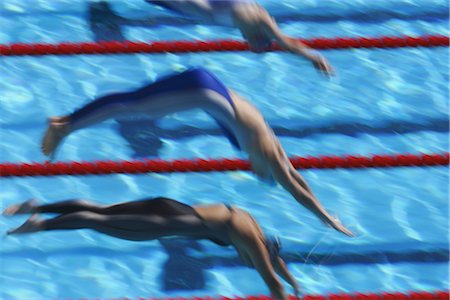 profile of person diving into pool - Swimmers diving into water Stock Photo - Rights-Managed, Code: 858-03046814