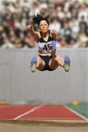 salto em distância - Long Jumper Foto de stock - Direito Controlado, Número: 858-03046990
