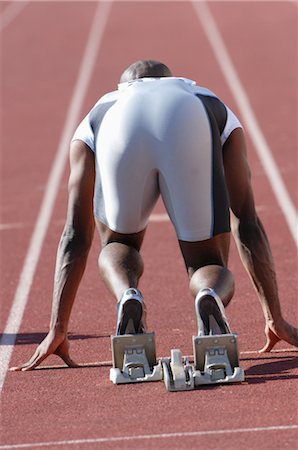 sprinters at starting blocks - Sprinter On the Starting Blocks Stock Photo - Rights-Managed, Code: 858-03047393