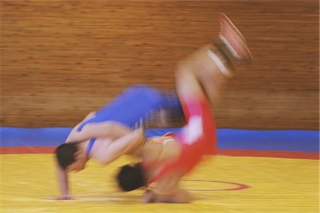 simsearch:858-03047596,k - Wrestler Throwing Opponent Stock Photo - Rights-Managed, Code: 858-03047619