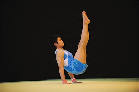 Young gymnast  balancing on his hands Stock Photo - Rights-Managed, Code: 858-03047717