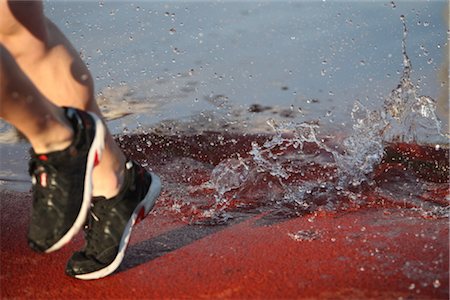fast closeup - Athlete avoiding water in the Steeplechase event Stock Photo - Rights-Managed, Code: 858-03048273