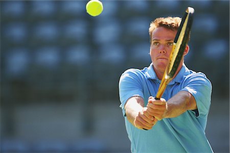 Tennis Player Hitting Ball Stock Photo - Rights-Managed, Code: 858-03048774