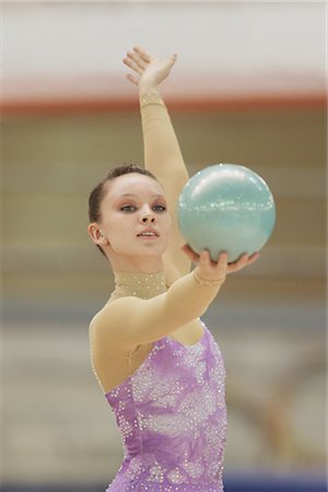 simsearch:858-03048912,k - Young woman performing rhythmic gymnastics balancing ball Stock Photo - Rights-Managed, Code: 858-03048934