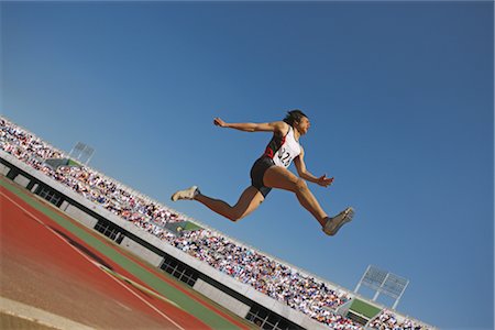 salto em distância - Long Jumper Foto de stock - Direito Controlado, Número: 858-03049096