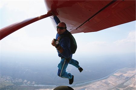 parachute jump - Man hanging on plane Stock Photo - Rights-Managed, Code: 858-03049395