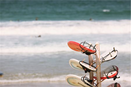 surfboard on water - Surfboard hanging and sea in background Stock Photo - Rights-Managed, Code: 858-03049498