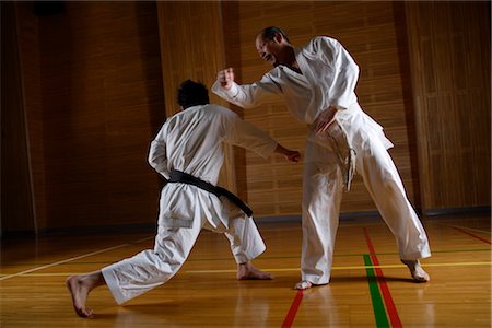 simsearch:858-03047596,k - Two karate contestants sparring Stock Photo - Rights-Managed, Code: 858-03049810