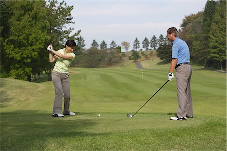 freizeitsportarten - Paar zusammen Golf spielen Stockbilder - Lizenzpflichtiges, Bildnummer: 858-03049934