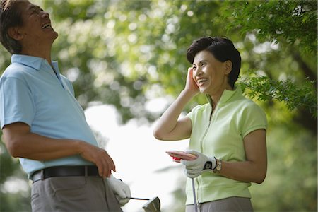 senior couple golf - Side view of a couple smiling Stock Photo - Rights-Managed, Code: 858-03049940