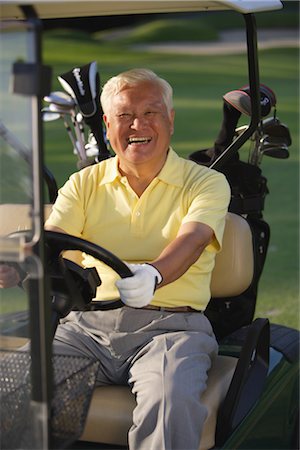 picture of man riding a cart - Senior man in golf cart Stock Photo - Rights-Managed, Code: 858-03049984