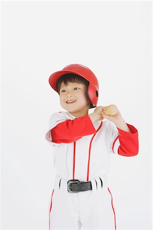 simsearch:858-03046840,k - Joueur de baseball souriant avec une batte de baseball Photographie de stock - Rights-Managed, Code: 858-03050032