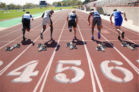 Sprinters Leaving the Starting Blocks Foto de stock - Direito Controlado, Número: 858-03050085