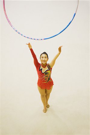 strong female acrobats - Young woman performing rhythmic gymnastics with hoop Stock Photo - Rights-Managed, Code: 858-03050214