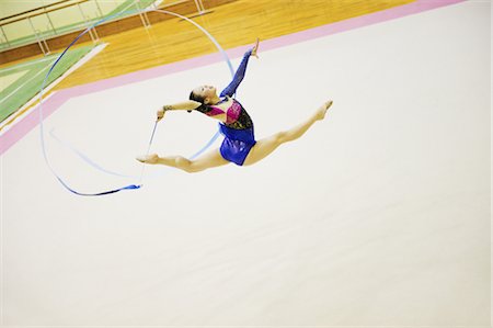 Woman performing rhythmic gymnastics with ribbon Foto de stock - Con derechos protegidos, Código: 858-03050227