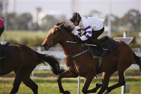 simsearch:400-03963631,k - Jockey sur un cheval au galop sur l'hippodrome Photographie de stock - Rights-Managed, Code: 858-03050484