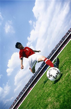 simsearch:858-03052307,k - Kicking the Soccer Ball Fotografie stock - Rights-Managed, Codice: 858-03051012