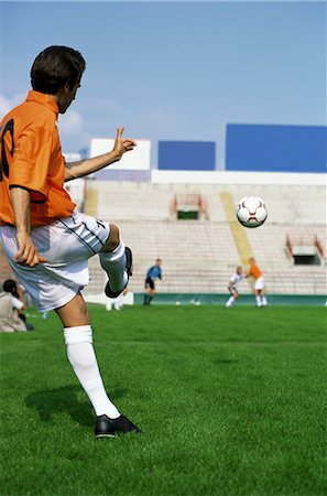 soccer goalkeeper backside - Kicking the Soccer Ball Stock Photo - Rights-Managed, Code: 858-03051026