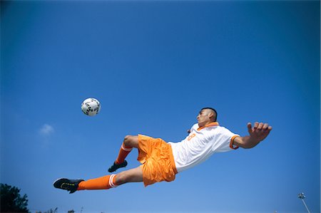 simsearch:858-03051086,k - Bicycle Kick Fotografie stock - Rights-Managed, Codice: 858-03051094