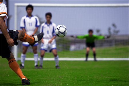 soccer goalkeeper backside - Kicking the Soccer Ball Stock Photo - Rights-Managed, Code: 858-03051234