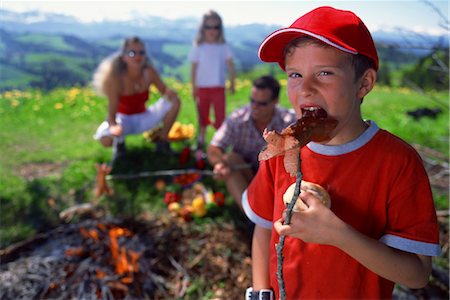 Boy eating hot dog Stock Photo - Rights-Managed, Code: 858-03053686