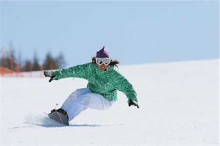 esporte de inverno - Snowboarder Riding on Snowfield Foto de stock - Direito Controlado, Número: 858-03448664