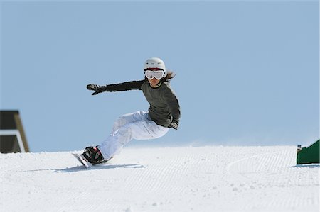 female asian snowboarders - Woman Snowboarding with Arms Outstretched Stock Photo - Rights-Managed, Code: 858-03448672