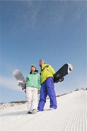 standing on snowboarding - Japanese Couple Standing in Snowfield Foto de stock - Con derechos protegidos, Código: 858-03448717