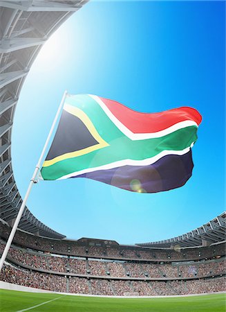 football stadium and sky - Soccer supports waving a South African Flag Stock Photo - Rights-Managed, Code: 858-03474767