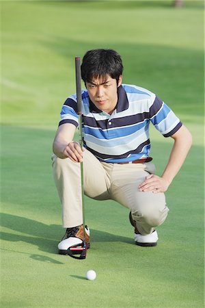 Man Playing Golf On Golf Course Foto de stock - Con derechos protegidos, Código: 858-03694372