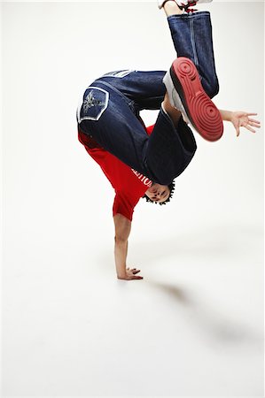 Hip Hop Dancer Performing in Studio Stock Photo - Rights-Managed, Code: 858-03694475