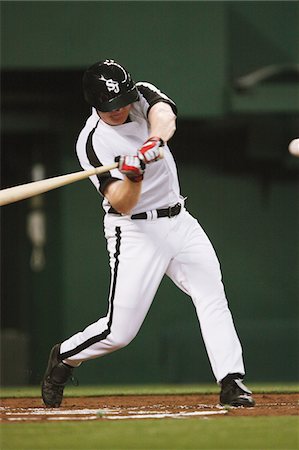 Baseball batter hitting ball Foto de stock - Con derechos protegidos, Código: 858-03799678