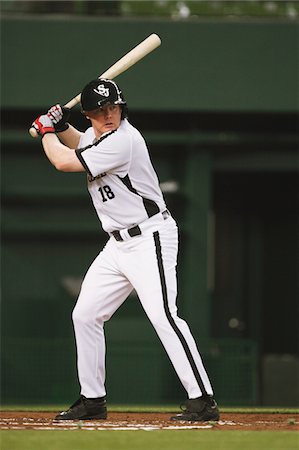 simsearch:858-03799672,k - Player holding bat playing baseball Foto de stock - Direito Controlado, Número: 858-03799683