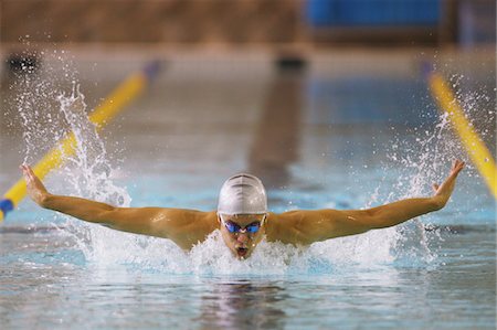 simsearch:600-05973054,k - Man swimming butterfly stroke Stock Photo - Rights-Managed, Code: 858-03799728