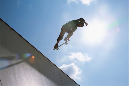 Skateboarder jumping from ramp Stock Photo - Rights-Managed, Code: 858-03799756