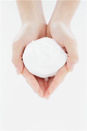 simsearch:859-07356378,k - Close up of woman's hands holding foaming cleanser Stock Photo - Rights-Managed, Code: 859-06404797