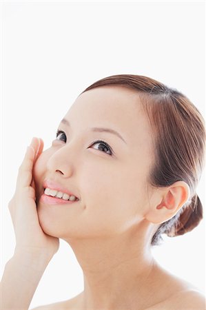 Portrait of a Japanese woman looking up and smiling Stock Photo - Rights-Managed, Code: 859-06404798