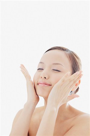 portraits of japanese women - Portrait of a Japanese woman holding her face with both hands Stock Photo - Rights-Managed, Code: 859-06404800