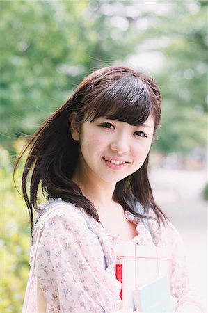 date (time) - Portrait of a Japanese girl smiling while looking at camera Stock Photo - Rights-Managed, Code: 859-06404836