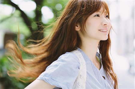 Portrait of a Japanese woman with long hair looking away Stock Photo - Rights-Managed, Code: 859-06404867