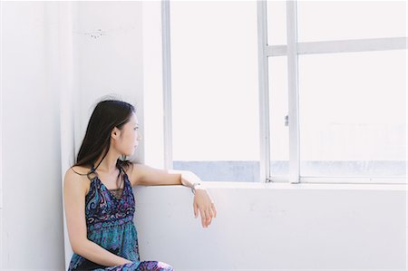 Japanese woman looking out of a window Stock Photo - Rights-Managed, Code: 859-06404879